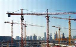 A large construction site with cranes.